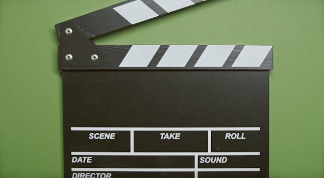 pexels photo 5662857 5662857 A classic film clapperboard on a green surface, essential for movie scenes.